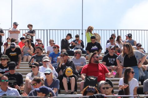 Fans in the grandstands look on as the IndyCar practice session takes place.