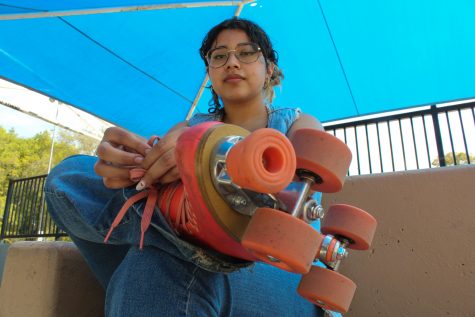Natalie Monzon, a first year graphic design major at CSULB, lacing up her Impala skates at El Dorado skate park.