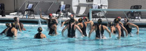 LBSU Women's Water Polo team getting ready as they are doing pre-game celebrations