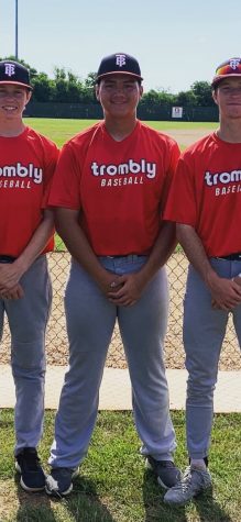 In the middle is Jonathan Long next to his teammates for Trombly baseball
