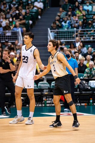 Nikolov on the left in the white jersey standing next to teammate Mason Briggs in the gold jersey at the Big West Championship game