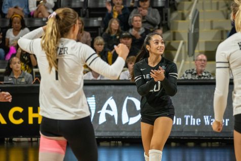 Dylan Dela Cruz (#20) of the CSULB Women's volleyball team claps after a successful kill against UCSB the Gauchos in CalState Long Beach's Pyramid on Friday, Oct. 7, 2022. (PHOTO: Marc Federici)