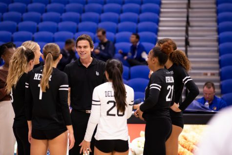 10/20/2022: Riverside, CA- LBSU head coach Tyler Hildebrand smiles at his team during Thursday's win against UCR after five sets.