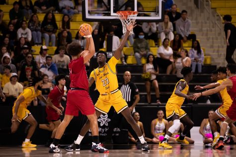 No where to go for Biola freshman forward Tyus Parrish-Tillman as LBSU sophomore forward Lassina Traore keeps his eye on the ball while staying ready to deflect a pass in the comeback win over Biola at home on Friday.