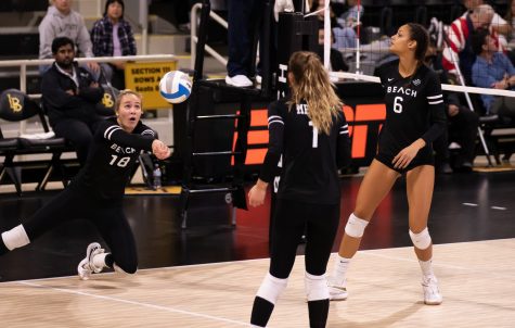 10/29/2022: Long Beach, CA- During Saturday's game against Cal Poly, LBSU junior opposite hitter Katie Kennedy dives for the ball during the team's win.