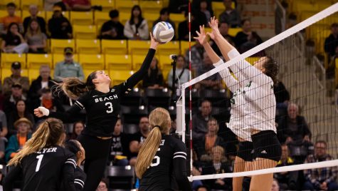 10/29/2022: Long Beach, CA- LBSU redshirt junior outside hitter Morgan Chacon tips the ball over the net in The Beach's win against Cal Poly on Saturday.
