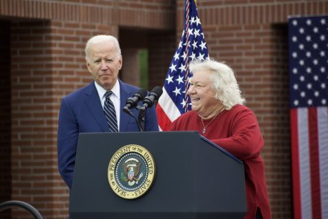 Susan Meyer gave a speech to visitors at Irvine Valley College on Friday, supporting President Joe Biden's fight for lowering drug costs.