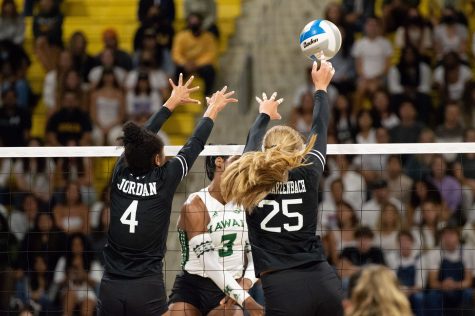 10/01/2022 - Long Beach, Calif: Long Beach State Women's volleyball players, Jaylen Jordan (#4) and Callie Schwarzenbach (#25), both go for a block on a kill attempt agaisnt Hawai'i during Saturday's game.