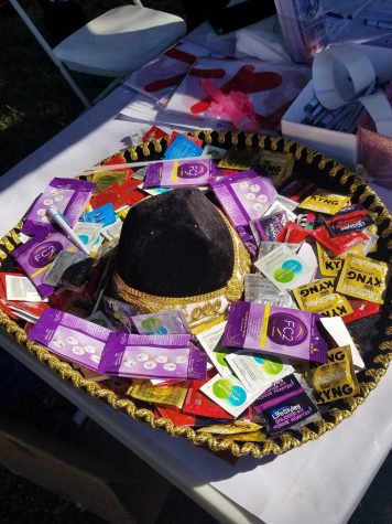 Condoms were available at the event to promote safe sex within the LGBTQ+ community.