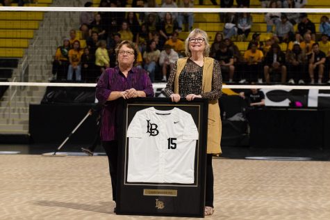 10/15/2022 - Long Beach, Calif: CSULB President Jane Close Conely presented long-time CSULB employee Cindy Masner with a commemorative jersey celebrating Masner's 37 years with the school.