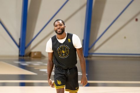 10/10/2022 - Long Beach, Calif: Long Beach State Men's Basketball player, Joel Murray, goes through the team's warm-up stretches during their Monday practice inside the Walter Pyramid.