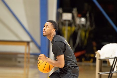 10/10/2022 - Long Beach, Calif: Long Beach State Men's Basketball player, Jason Hart Jr., puts some shots up before the men's team's Monday practice inside the Walter Pyramid.