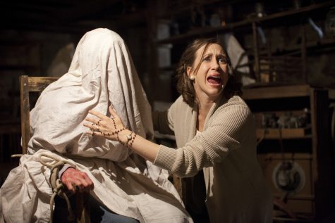 Lorraine Warren, played Vera Farmiga (right), is a demonologists who is trying to help Carolyn Perron, played by Lili Taylor (left), during an exorcism as the demon takes over Carolyn's body.