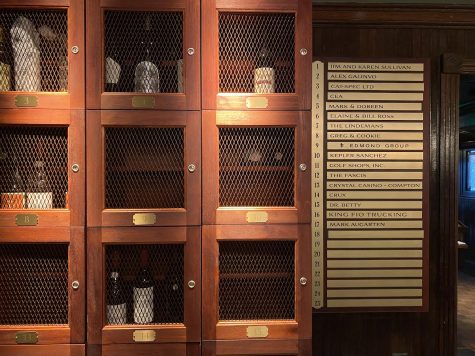 A wine cellar and wall of plaques commemorating long-time regulars at 555 East.