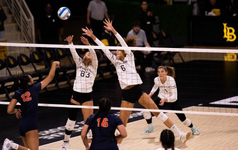 11/01/2022: Long Beach, CA- Blocks are sparce against CSUF as sophomore outside hitter Natslie Glenn (left) and sophomore middle blocker Kameron Bacon (right) reach up to block an opposing shot during Tuesday's win at home in The Pyramid.
