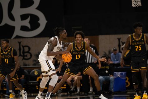 11/13/2022 - Long Beach, Calif: Long Beach State men's basketball player, Chayce Polynice (#13), plays on-ball defense against Montana State's Jubrile Belo inside the Walter Pyramid on Sunday.