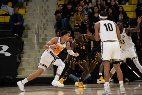 11/13/2022 - Long Beach, Calif: Long Beach State men's basketball player, Aboubacar Traore cuts off the drive to the basket during the Beach's matchup against Montana State.