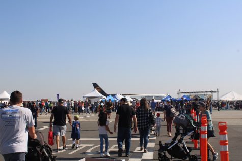 Many families enter the Long Beach Airport gates as the festival is underway.