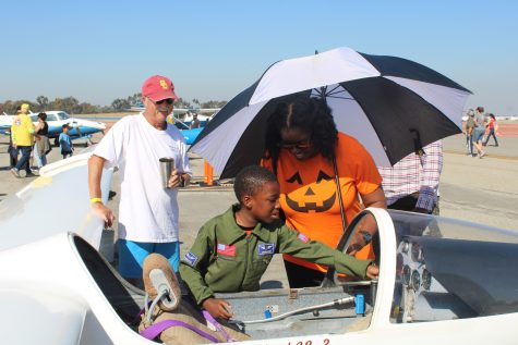 A young kid gets hand-on experience as we learns the different parts of the aircraft.