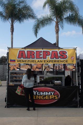 Arepas is a Venezuelan food booth at the farmers market held on campus in front of the Student Recreation and Wellness Center. Photo by: Kamryn Bouyett