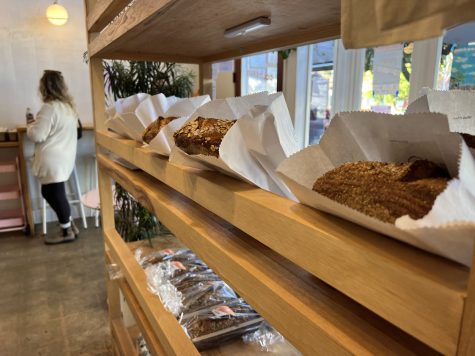 Loaves of bread on display are available to purchase when entering Colossus Bread. But don't squeeze them! Customers need to ask staff for help if they have any questions about the bread, according to signs inside.