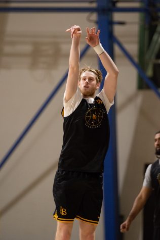 01/24/2022 - Long Beach, CALIF: Norwegian basketball player, Tobias Rotegaard, takes a shot from the left corner during Tuesday's practice inside the Walter Pyramid.