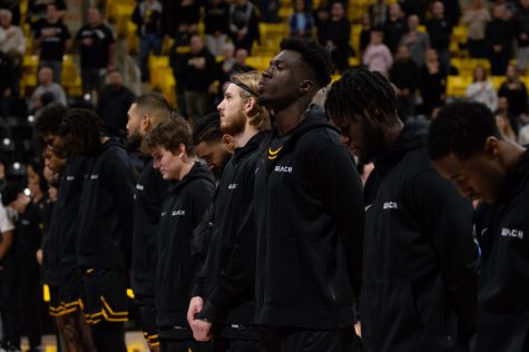 11/13/2022 - Long Beach, CALIF: Norwegian basketball player, Tobias Rotegaard (fourth from right), lines up alongside his Long Beach State teammates before their game against Montana State tips off.