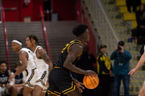 11/13/2022 - Long Beach, CALIF: Long Beach State men's basketball player, Aboubacar Traore, brings the ball up the court during the game against Montana State back in November.