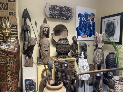 An assortment of cultural artifacts on display at H. Maxie Viltz's shop, Village Treasures.