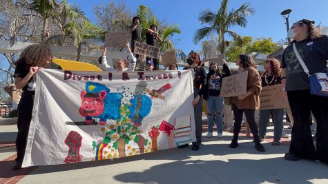 Students from the Cultural Resource Center protest at the Go Beach sign after the murder of Tyre Nichols