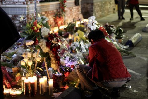 Mourners placed flowers with hand written notes during the vigil on January 24, 2023