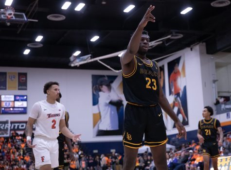 02/02/23: Long Beach, CA- LBSU sophomore forward Lassina Traore declares it is The Beach's ball after it rolled out of bounds during the Thursday night win against CSUF.