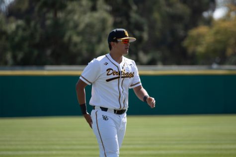 02/12/2022 - Long Beach, Calif: CSULB Dirtbags Freshman Infielder, Armando Briseño, warms up and streches before his inter-squad scrimmage on Sunday at Blair Field.