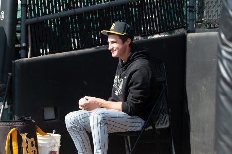 02/12/2022 - Long Beach, Calif: CSULB Dirtbags Junior Left-Handed Pitcher, Graham Osman, cleans the baseballs prior to the start of the Dirtbags scrimmage on Sunday.