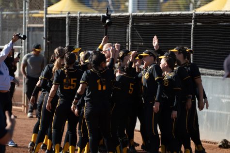 02/12/2023 - Long Beach, Calif: The Long Beach State softball team gather in a huddle before beginning their regular season home-opener double-header against the University of San Diego.