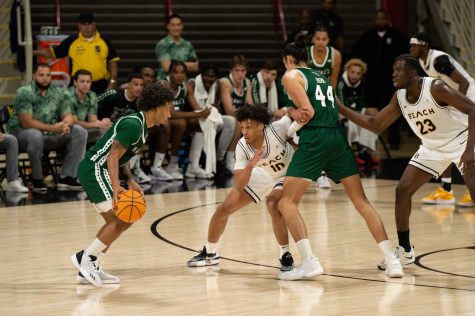 02/18/2023 - Long Beach, Calif: LBSU men's basketball player AJ George (#10) and Lassina Traore (#23) defend the pick and roll against Hawaii inside the Walter Pyramid.