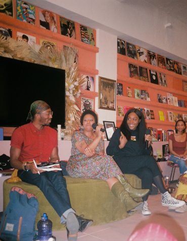 Noname is pictured (in black, on the right) at a Los Angeles Noname Book Club meet up.