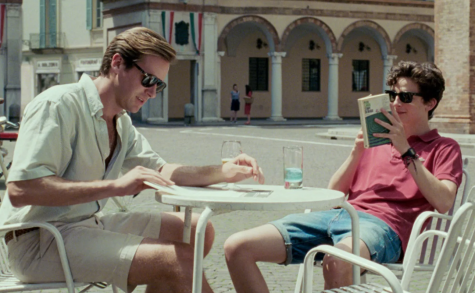 Oliver (Armie Hammer) and Elio (Timothée Chalamet) sitting at a café in Italy enjoying each others company. Sayombhu Mukdeeprom | Sony Picture Classic