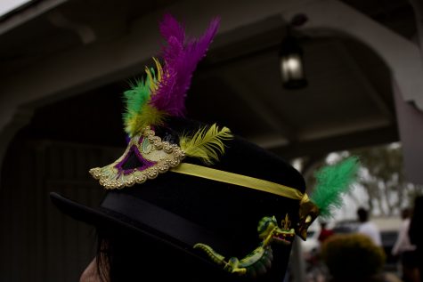 Carnival goer Dina Coutri made this hat featuring an alligator, feathers and a mask to incorporate some of Mardi Gras’ southern influence.