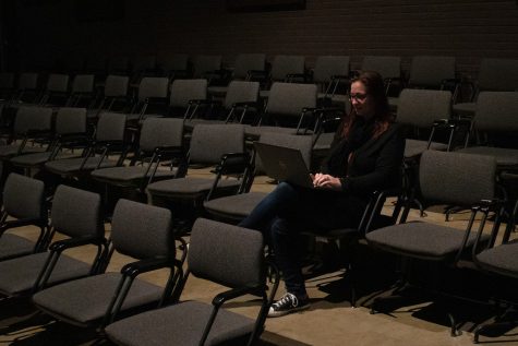 Even during the height of a productions run, some days the main auditorium is quiet while the crew adjusts the lights and Boehne Ehlers can enjoy the ambiance while answering emails. Photo by Steven Matthews