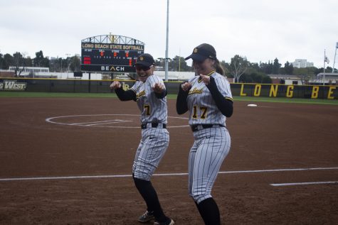 LBSU softball infielders Selena Perez (left) and Cassie Camou (right) dancing to “Crank That (Soulja Boy)” by Soulja Boy in a dance battle against Oregon at the LBSU softball complex.