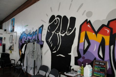 03/07//2023 - Wall Art inside Level Up Barber Studio featuring the fist of the Black Lives Matter movement.