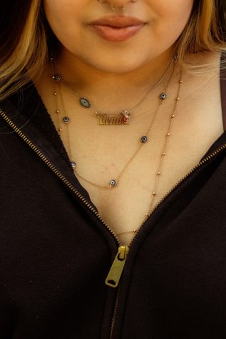 Student Venus Herrera&squot;s "evil eye" necklace exhibits her religious belief, Spiritual Individualism, which is a protection from three kinds of curses (unintentional, intentional and unseen).