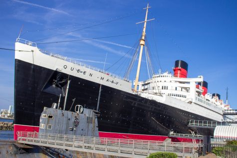 Exterior view of Queen Mary with a US submarine in the foreground,
