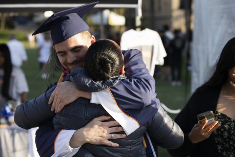 CSUF graduates celebrate at their commencement ceremony with family in 2022.