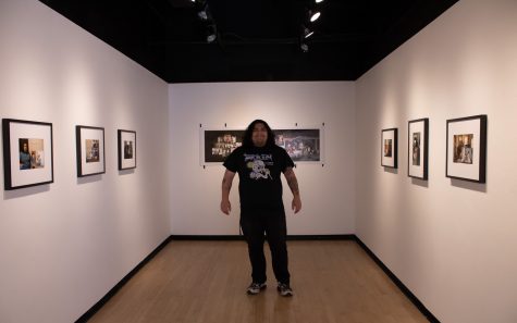 05/03/2023 - Long Beach, CA: Gabriel Gonzales stands in the middle of his gallery, he placed out his photos in specific spots so it can resemble how his home looks.