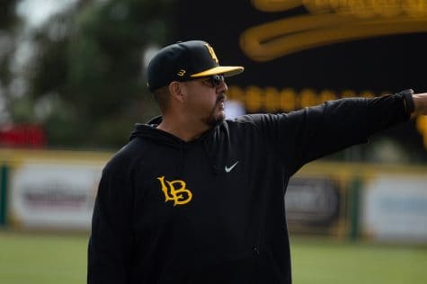 02/12/2022 - Long Beach, Calif: CSULB Dirtbags Head Coach, Eric Valenzuela, coaches his team during practice and the scrimmage at Blair Field.