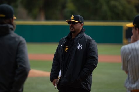 02/12/2022 - Long Beach, Calif: CSULB Dirtbags Head Coach, Eric Valenzuela, leads the team huddle prior to the start of their inter-squad scrimmage at Blair Field.