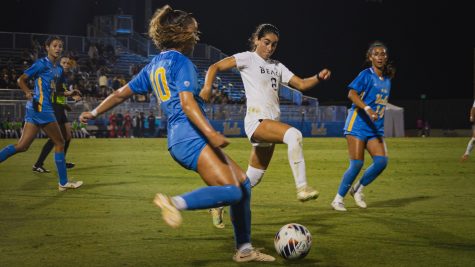 09/07/2023 - Long Beach, Calif: Long Beach State women's soccer sophomore forward Cherrie Cox contests a pass from a UCLA defender in The Beach's matchup against the Bruins at Wallis Annenberg Stadium.