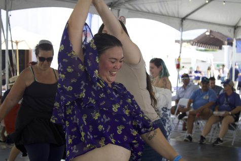 Festival attendees take on the dance floor at the Greek festival, learning traditional Greek dances.